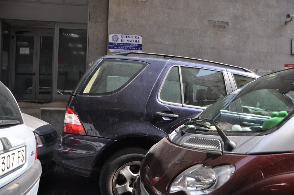 Double parked cars for post about driving in Italy tips